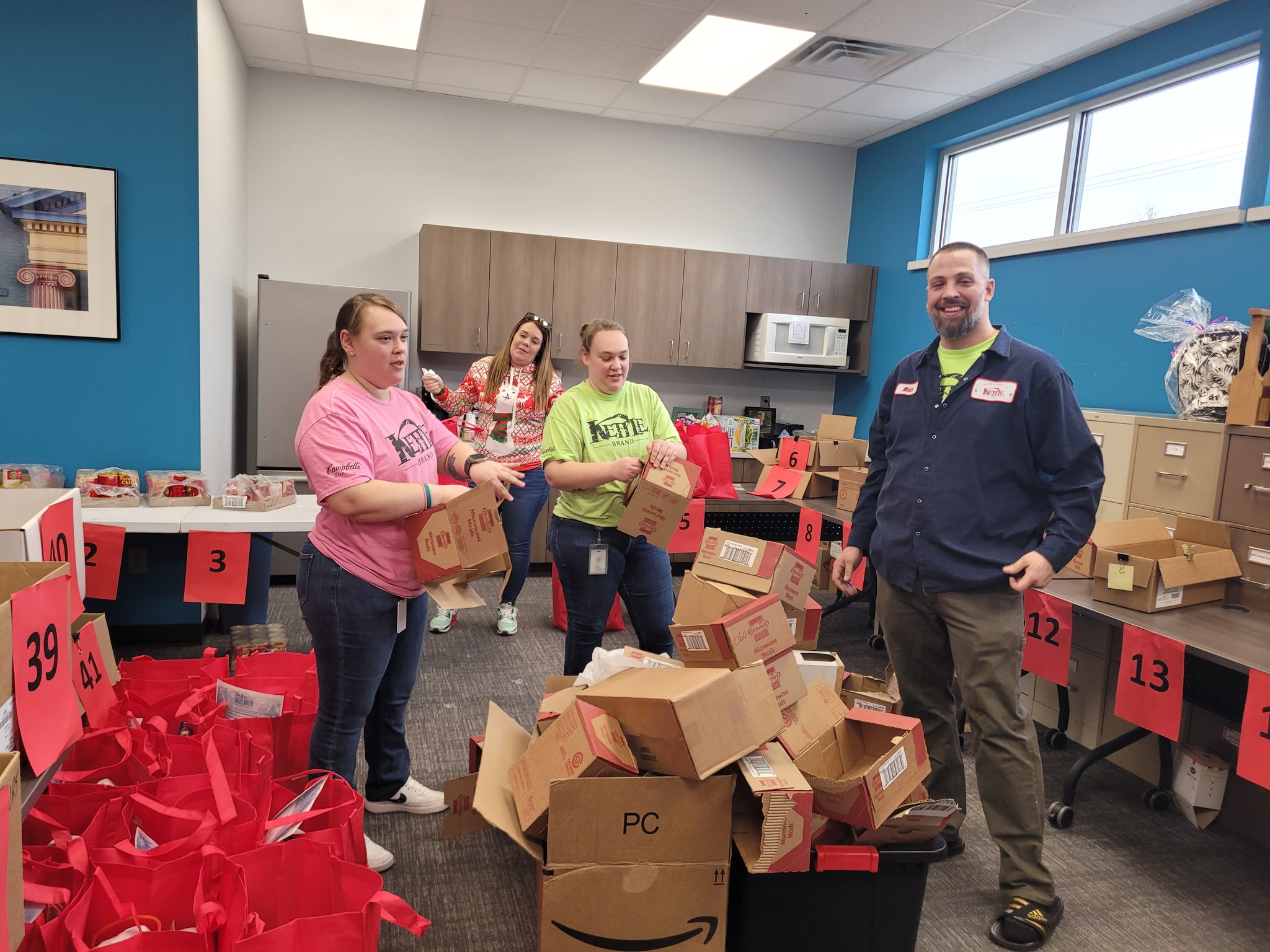 Beloit volunteers packing “blizzard bags” for Meals on Wheels