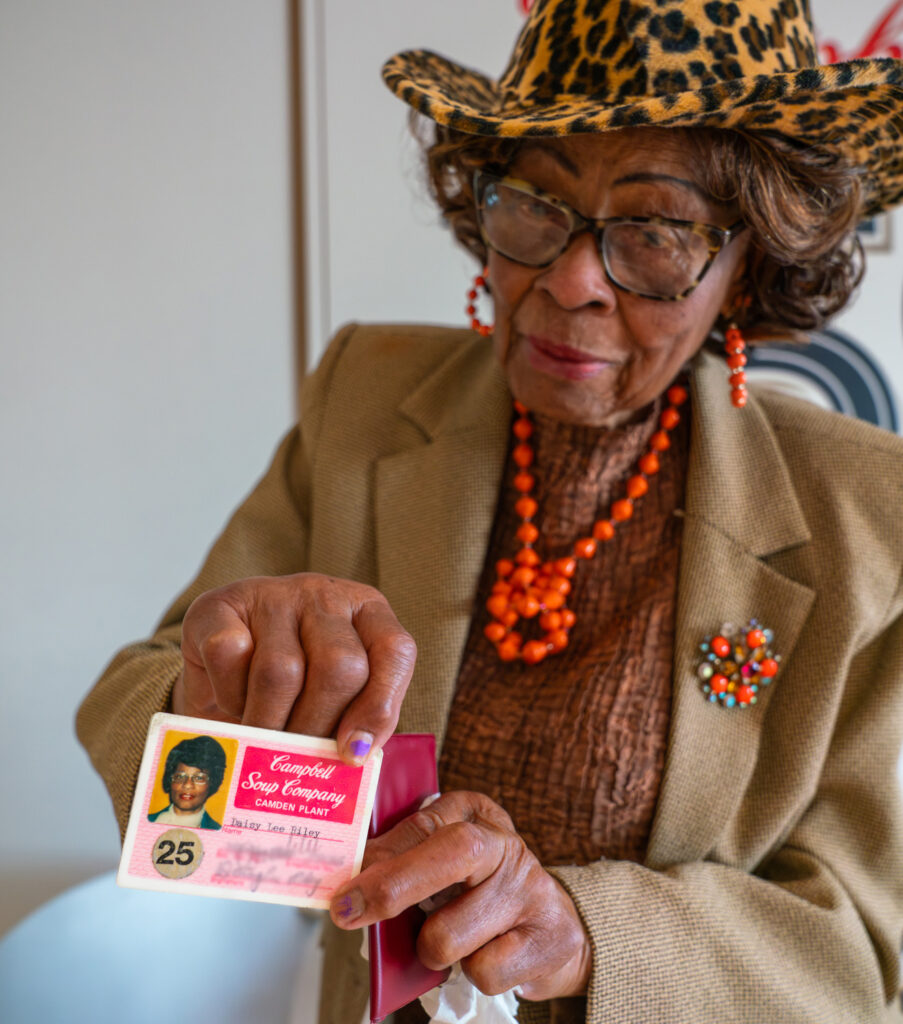 Daisy Lee Riley shows old Campbell's employee badge