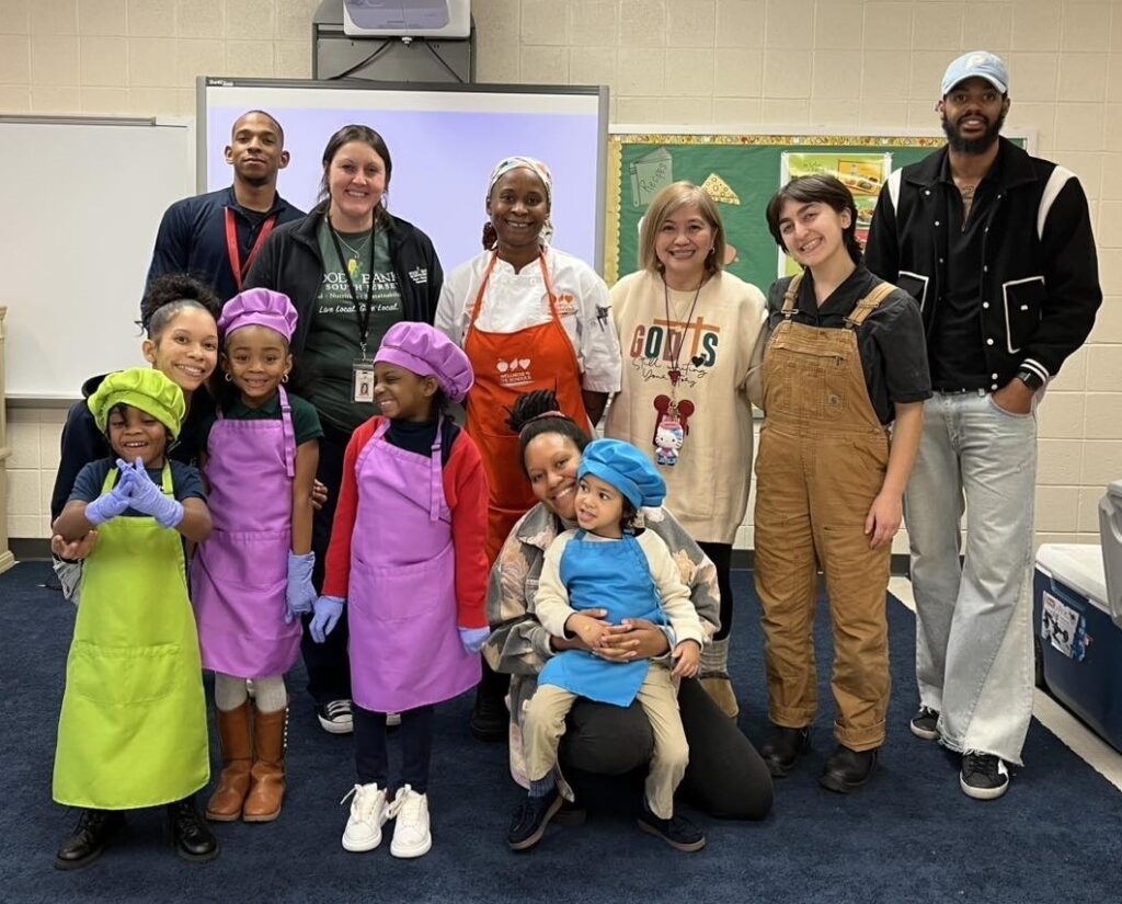 Full Futures cooking class poses for photo in classroom