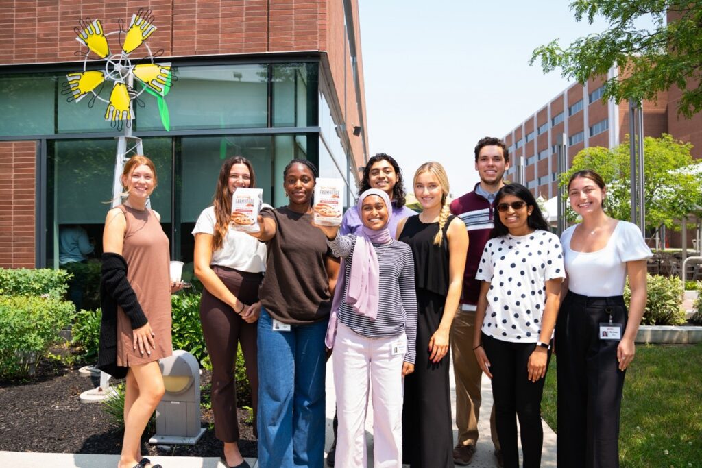 Interns pose with Pepperidge Farm cookies