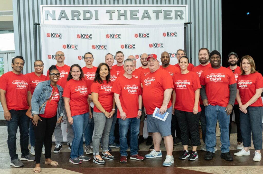 Campbell employees pose as group at Salvation Army Kroc Center Camden