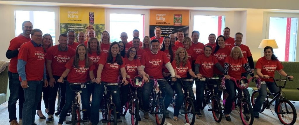 Employees pose with bikes