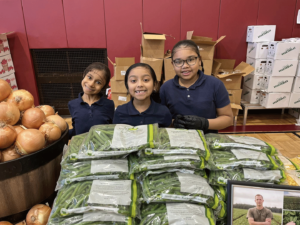 Students connect with local farmers at The Common Market’s monthly market to explore fresh, local ingredients.