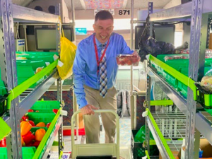 Volunteer helps bring fresh, nutritious produce to families through Hanover’s Online Pantry Program.