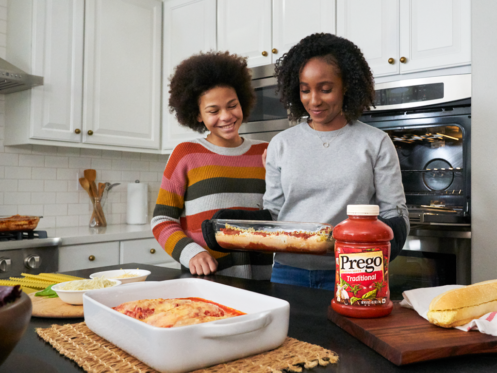 Family making dinner with Prego